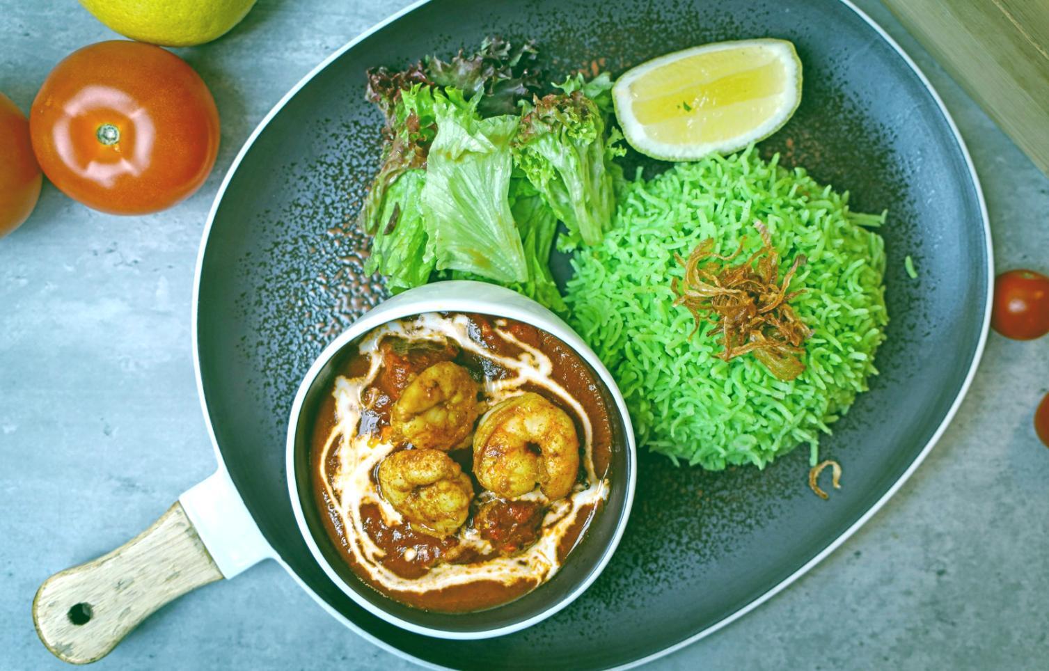 Chef carefully placing garnish on a restaurant dish